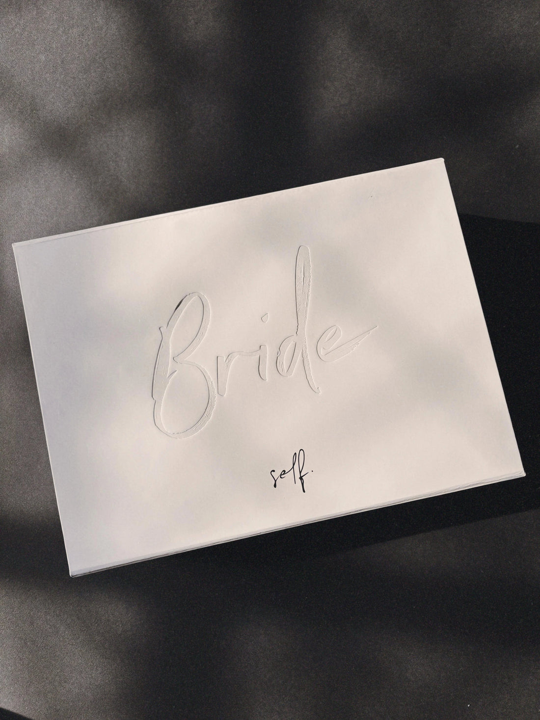 A luxurious white box for bridal products, featuring a curated playlist for brides in collaboration with Spotify.