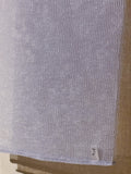 Close-up of The Exfoliating Towel in Lilac – Durable, textured material for deep exfoliation and skin rejuvenation