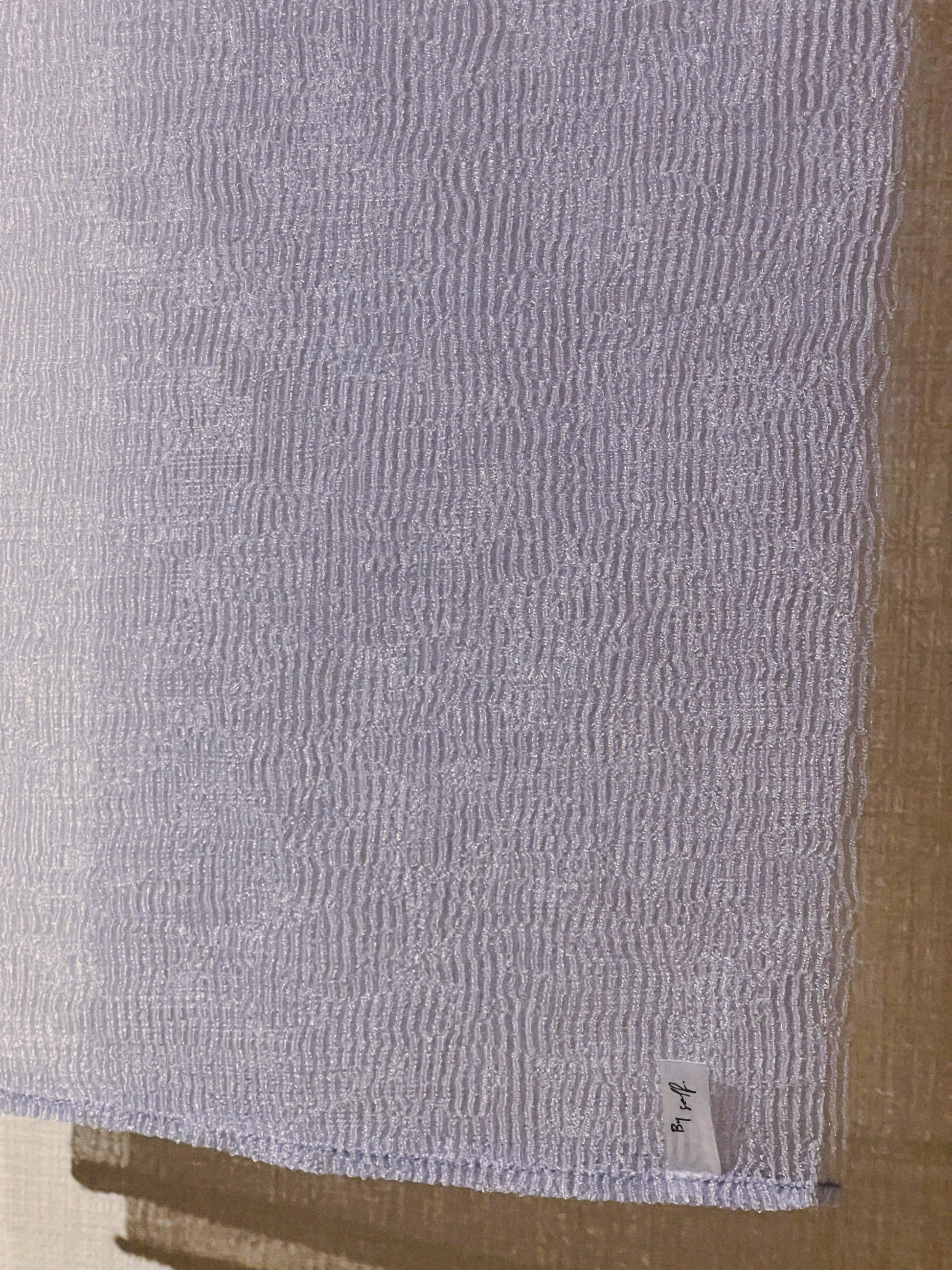 Close-up of The Exfoliating Towel in Lilac – Durable, textured material for deep exfoliation and skin rejuvenation