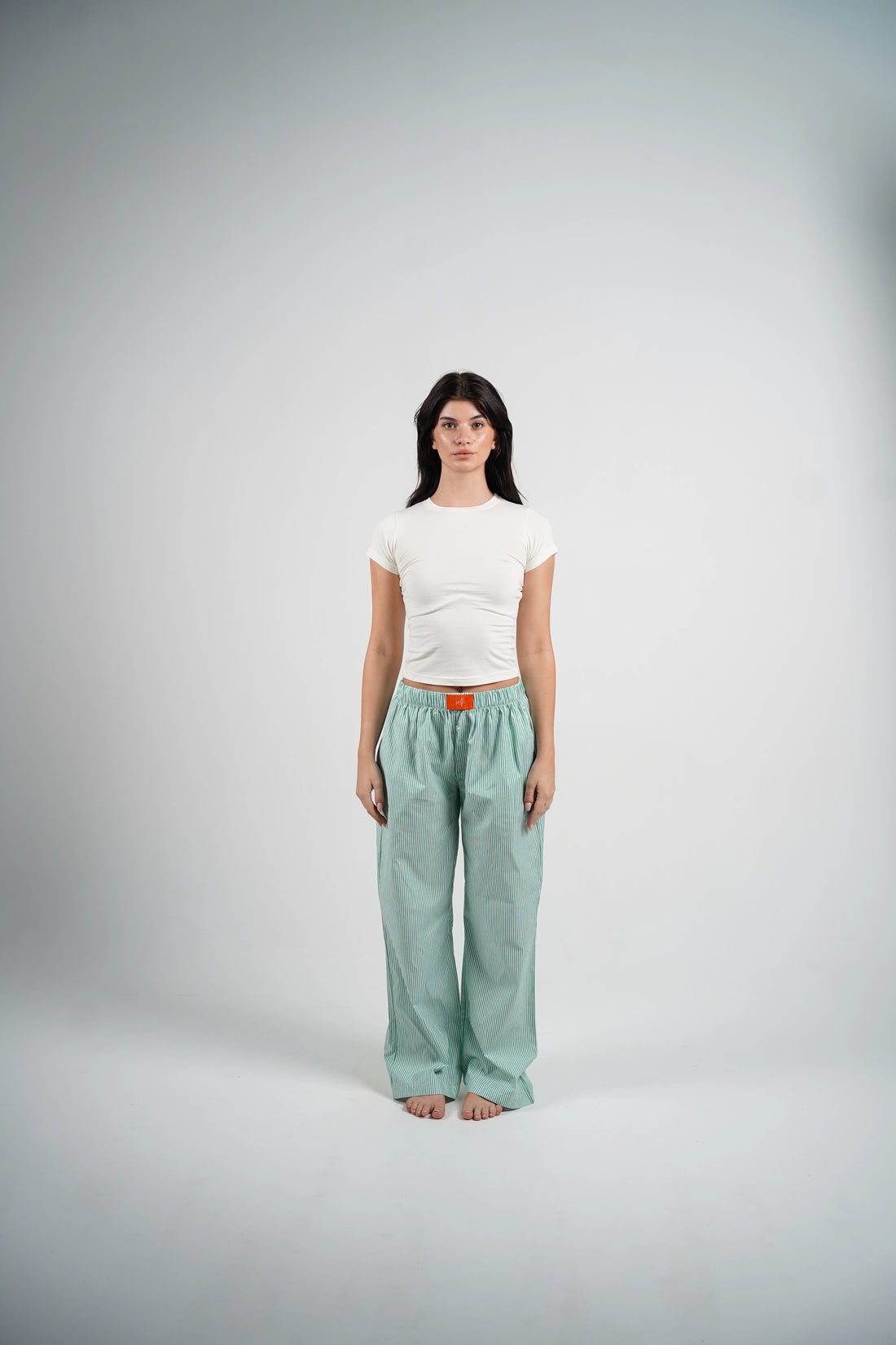 The Green Striped Set with a white top and green striped pants, perfect for lounging at home