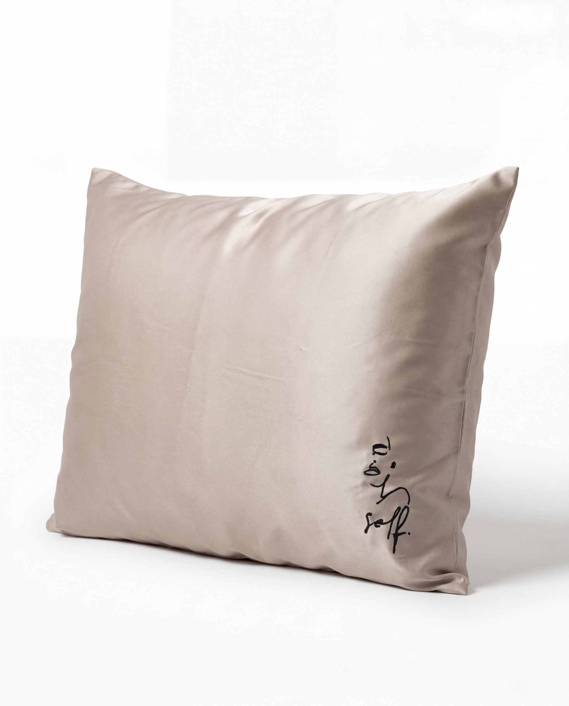 Beige pillow with 'very soft' text on a white background