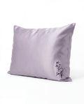 Lavender pillow with 'self' text on a white background