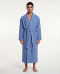 Man wearing a blue robe on a white background