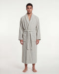 Man wearing a sage robe on a white background