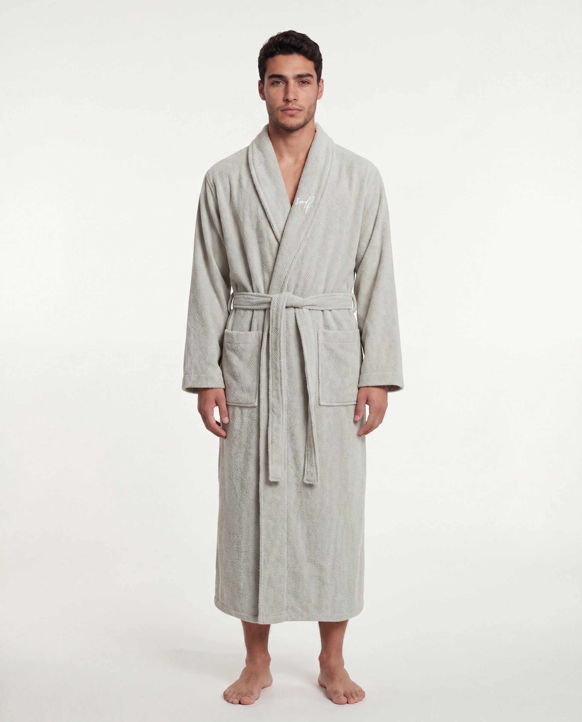 Man wearing a sage robe on a white background
