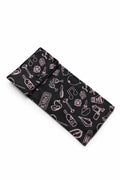 Black fabric with pink music-themed pattern on a white background